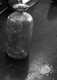 Old flagon-shaped glass bottle