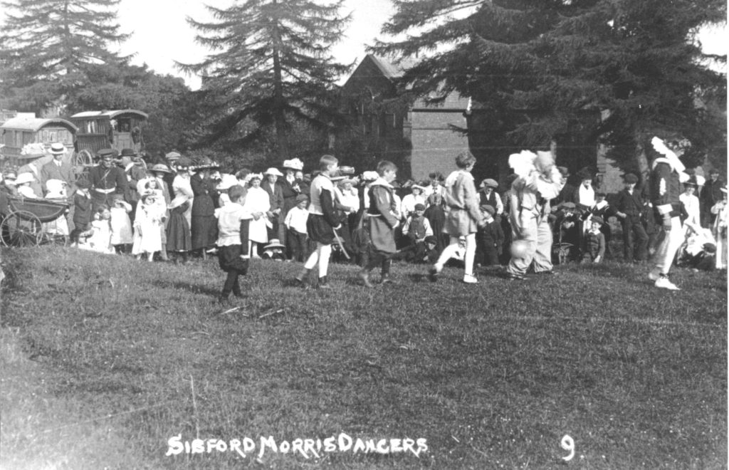 An old photo of a group of people in a field
