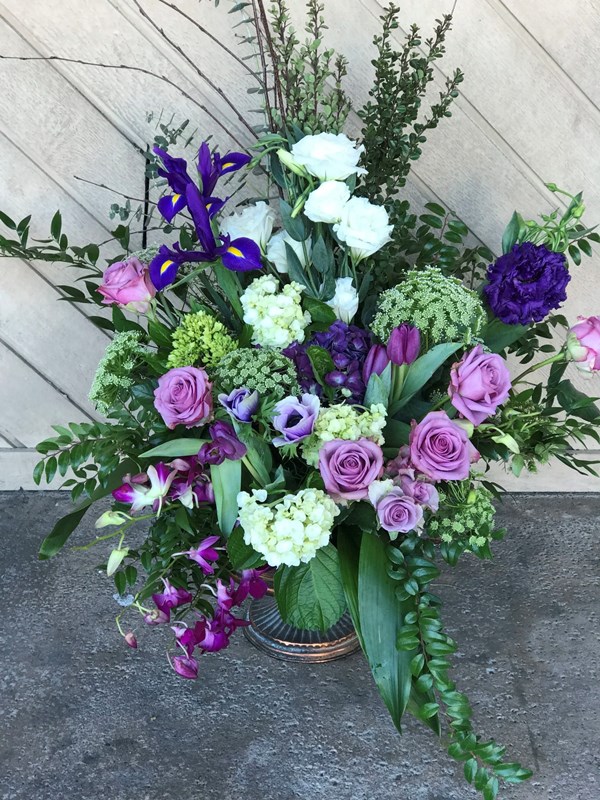 A vase filled with purple flowers