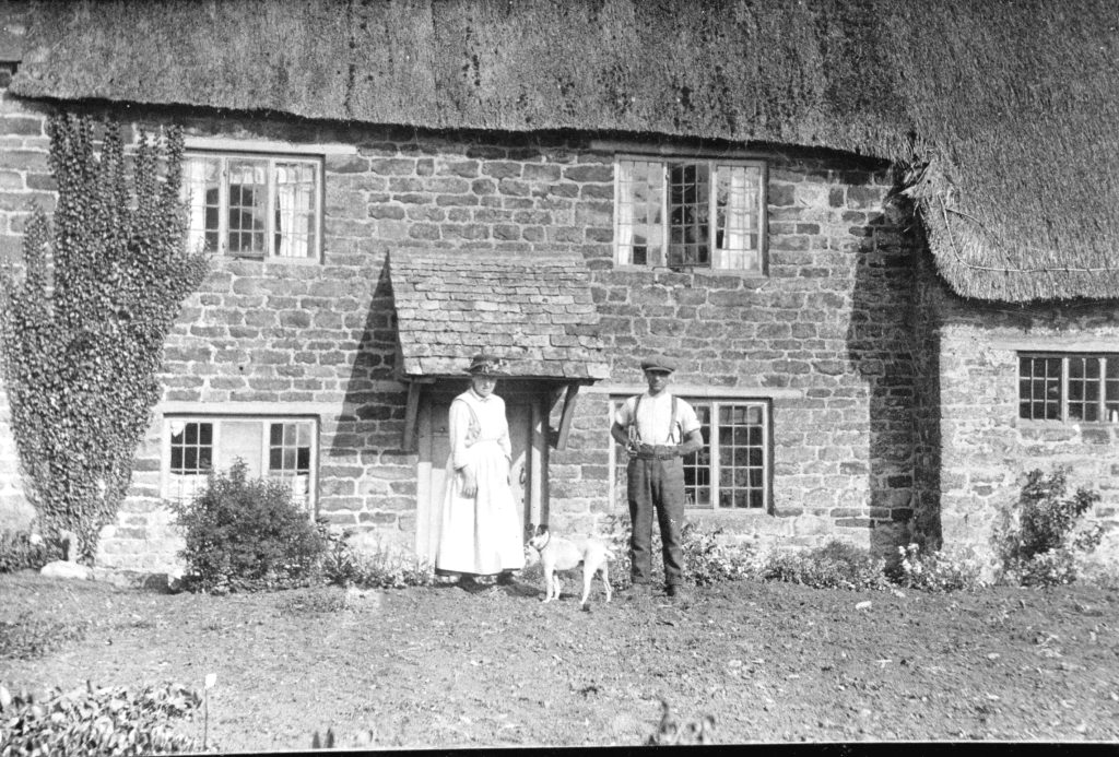 A vintage photo of an old brick house