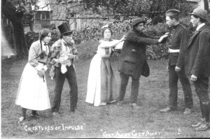 A vintage photo of a group of people posing for the camera
