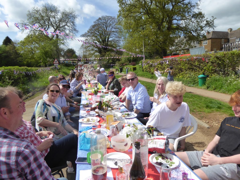 A group of people sitting at a picnic table
