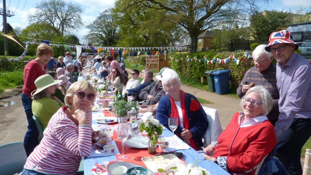 A group of people sitting at a table eating food