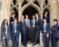 A group of people standing in front of a building