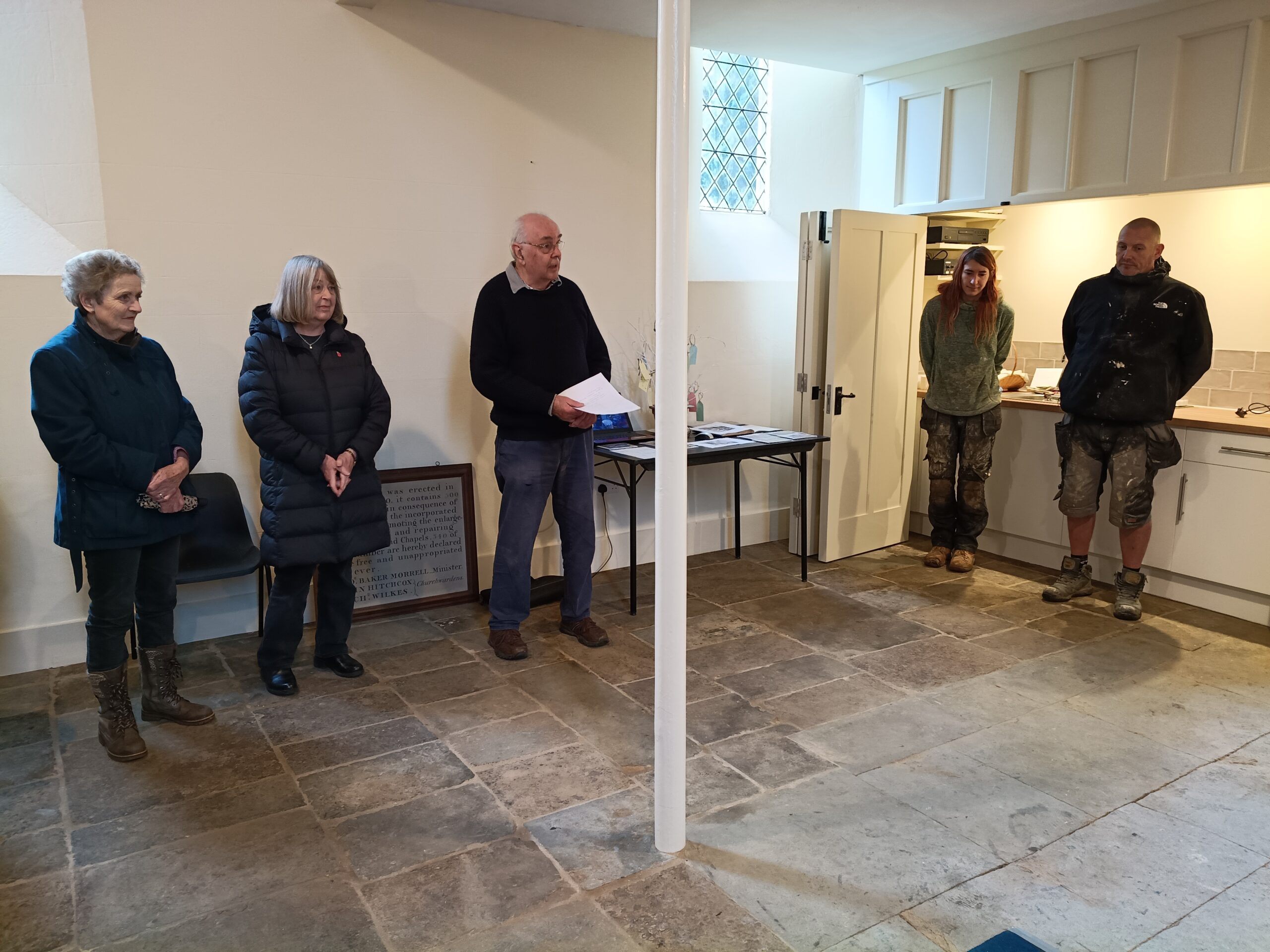 A group of people standing in a room