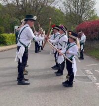 A group of people walking down the street
